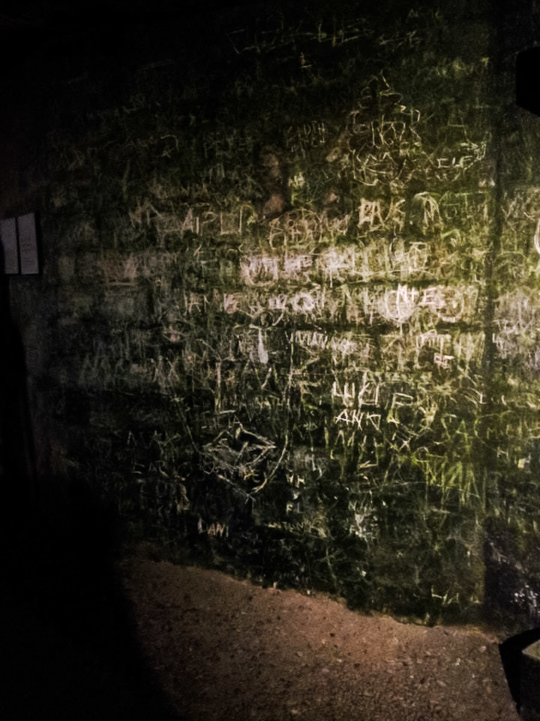 Graffiti wall in the Paris Catacombs. 