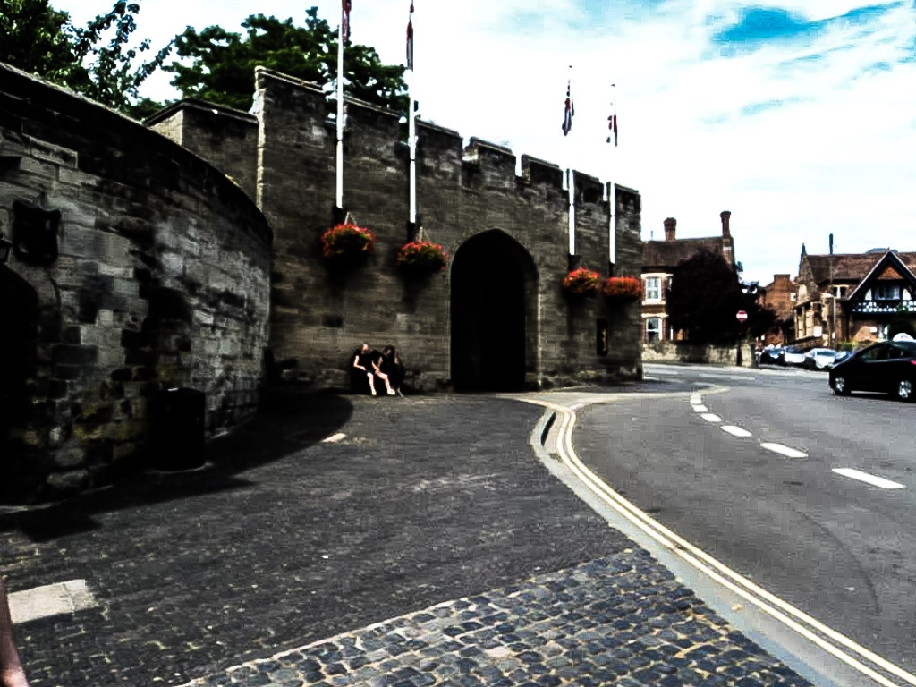 Road running alongside the outside of Warwick Castle. 