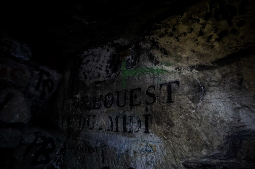 Street names written on the walls of the Paris Catacombs. 