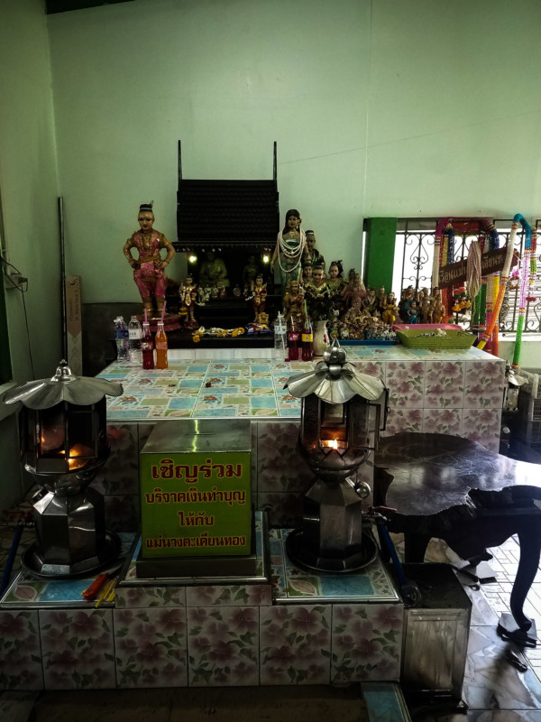 Mae Nak's offering table within her shrine in Bangkok. 