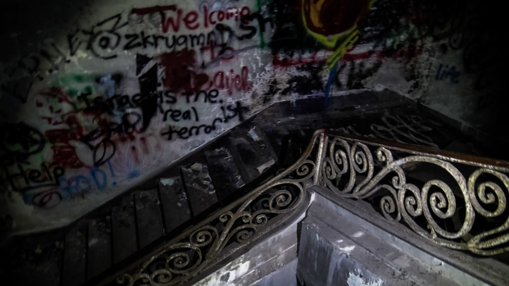 Graffiti covered staircase of abandoned mansion in Singapore. 