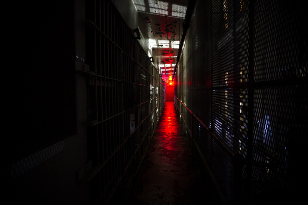 Hallways by night inside haunted prison. 