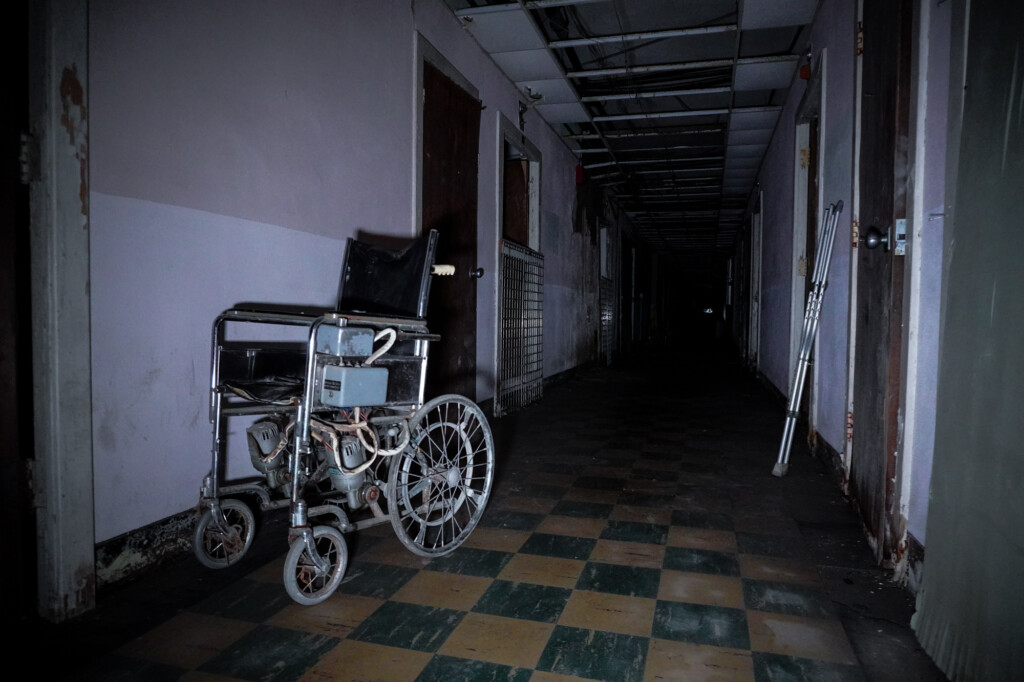 Haunted hallway inside abandoned hospital. 